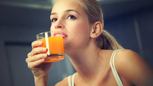 Woman-drinking-orange-juice