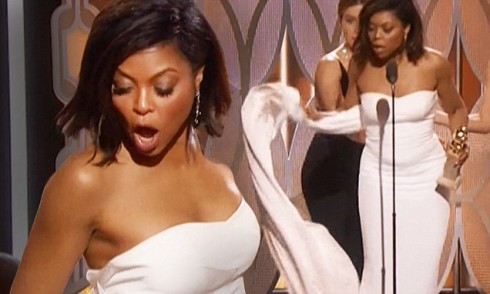 Another person stands on Taraji P henson dress train