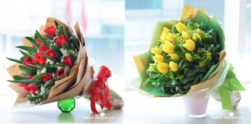 Bó Tulip đỏ và vàng 15 cành e ấp giữa những nhành Lan Chi, Calimero. Bên trái: Mẫu “Hôn môi xa”, bên phải: Mẫu “Tình yêu màu nắng”. Giá: 722.500 đồng*.