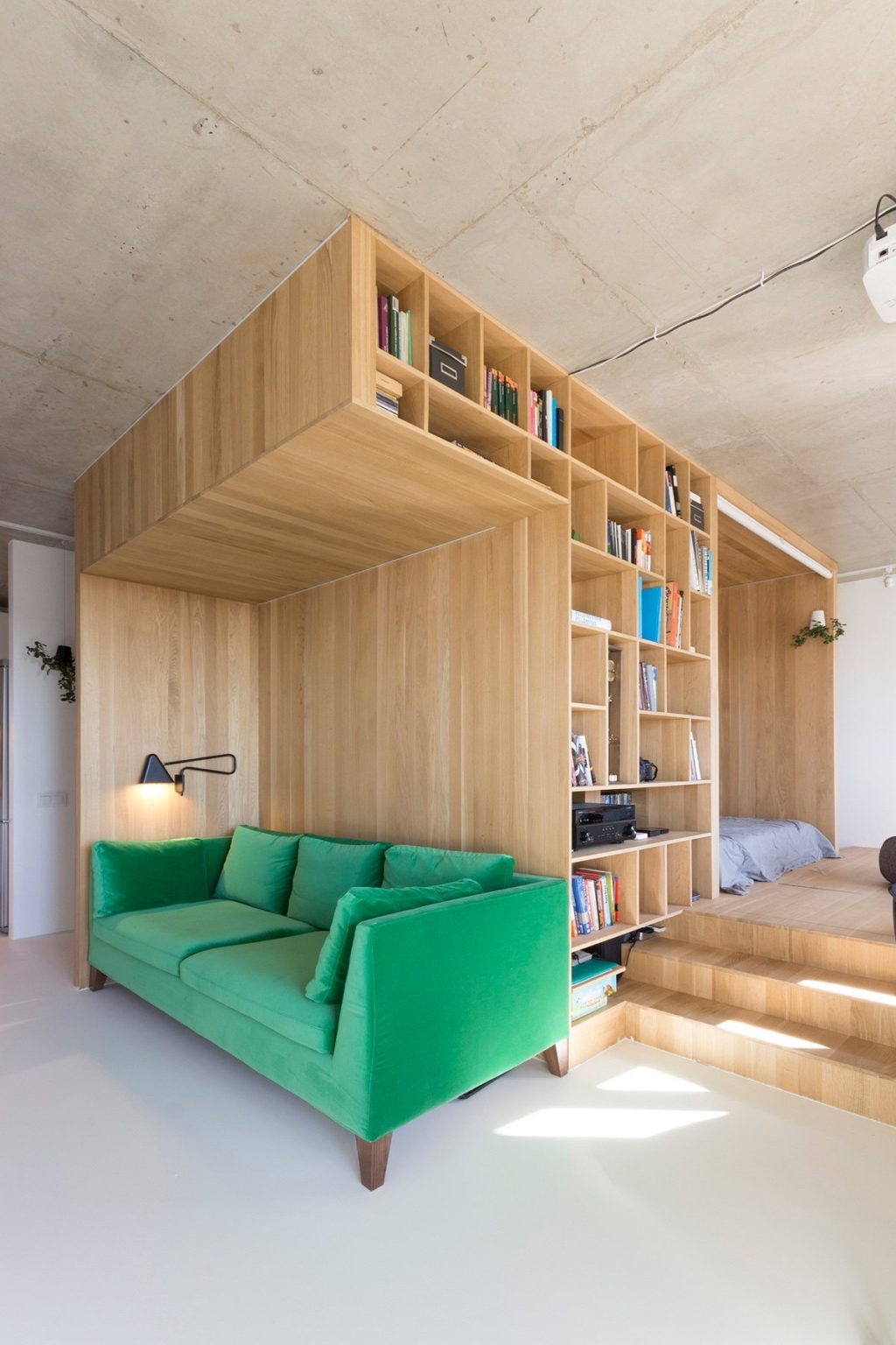 1.Feature-leaf-green-velvet-couch-under-50sqm-living-room-backed-by-bookcase