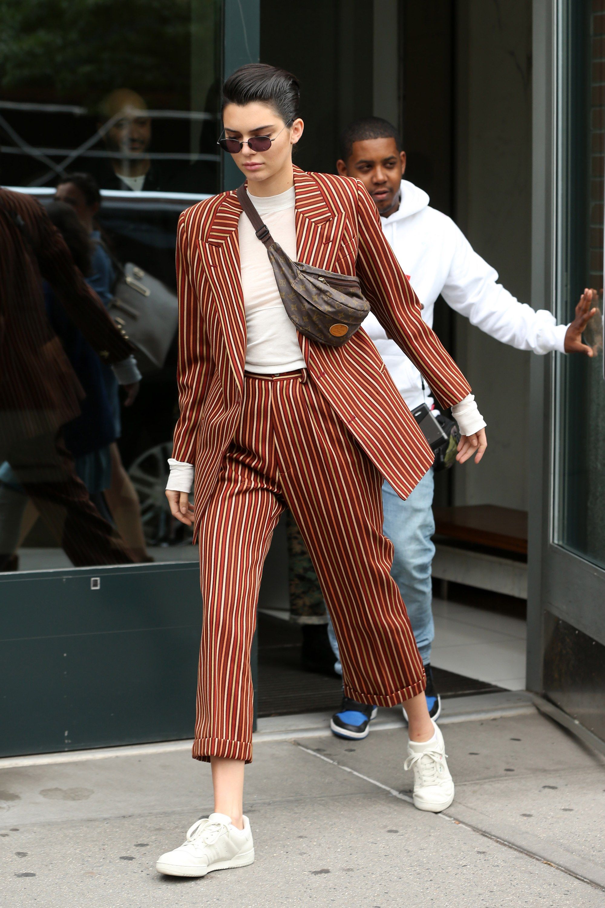 kendall jenner dressed in white tennis shoes and suit guys