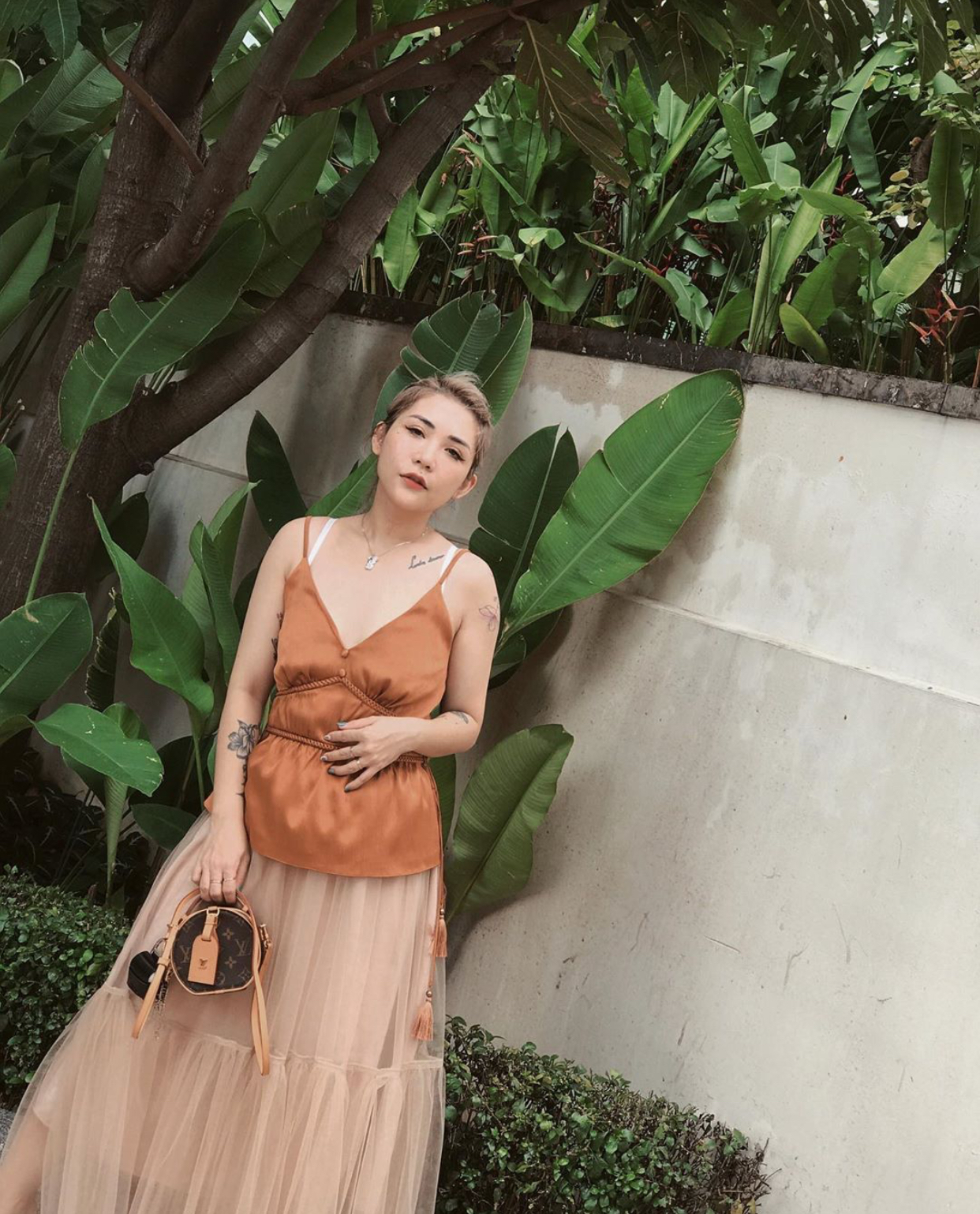 Lâm Thuý Nhàn mặc áo hai dây peplum và tulle skirt