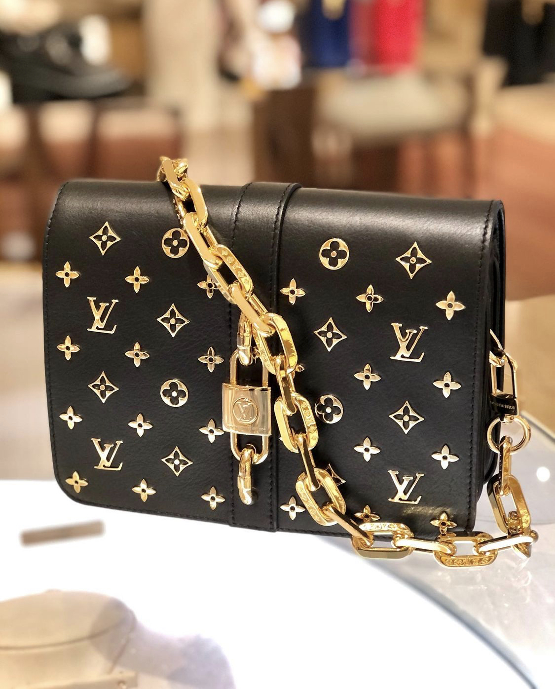 lv rendez vous bag in black with gold detail closeup merfylvsg