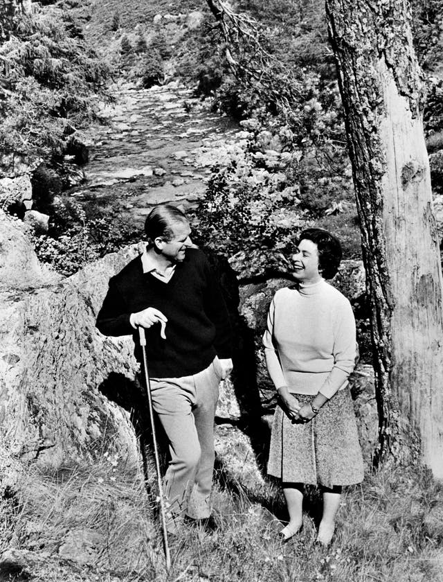 Queen Elizabeth and the Duke pose at Balmoral in a trip