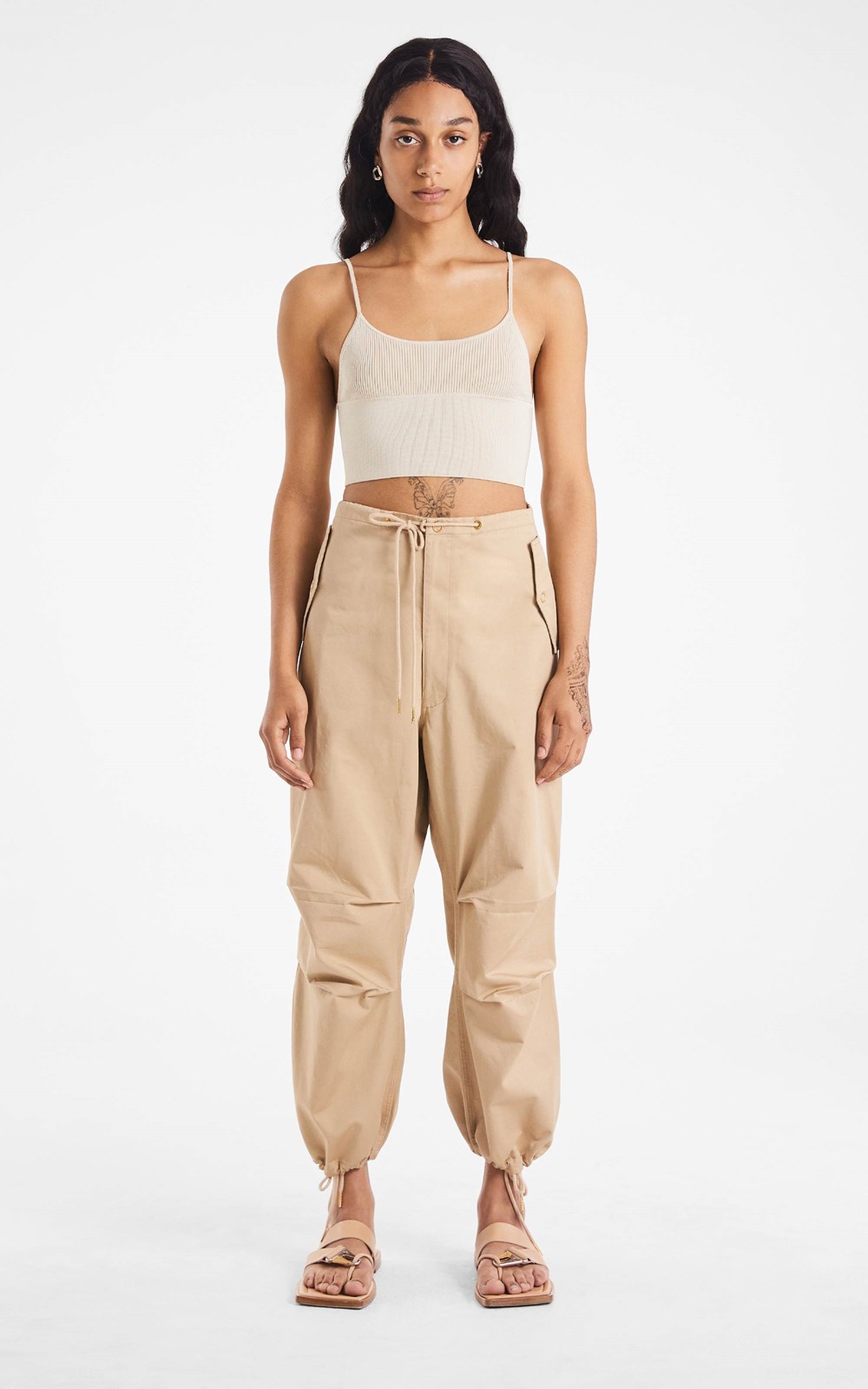 Beige parachute pants with two-piece shirt