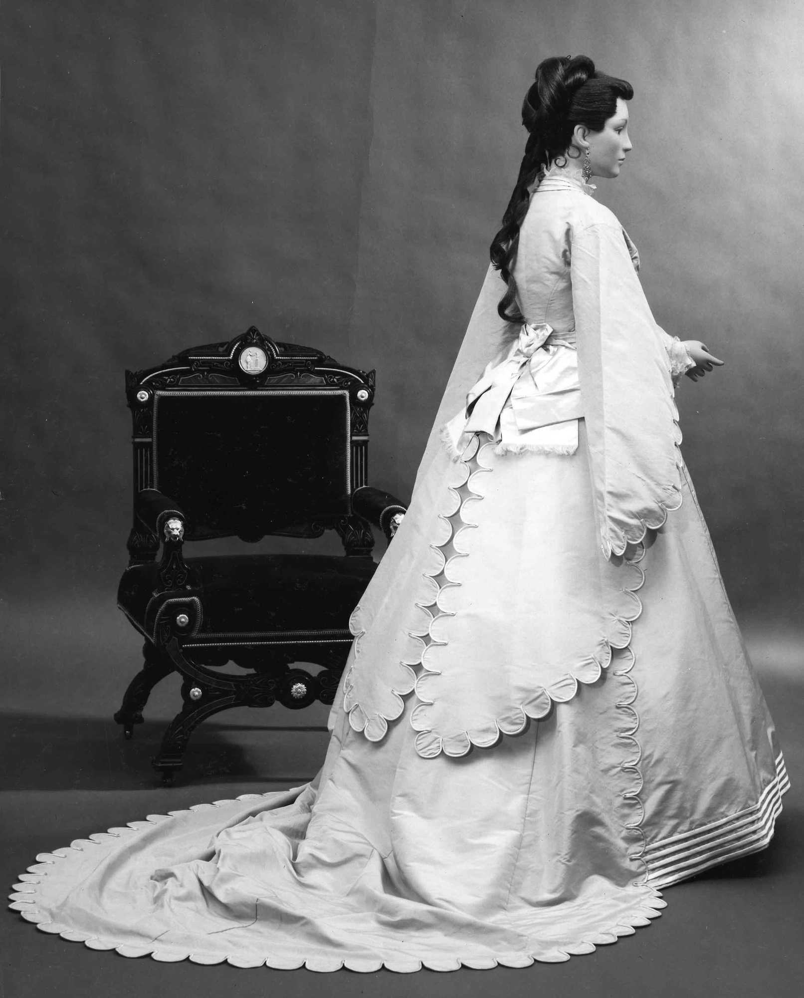 Fashionable 1870 wedding dress by trailing fabric design