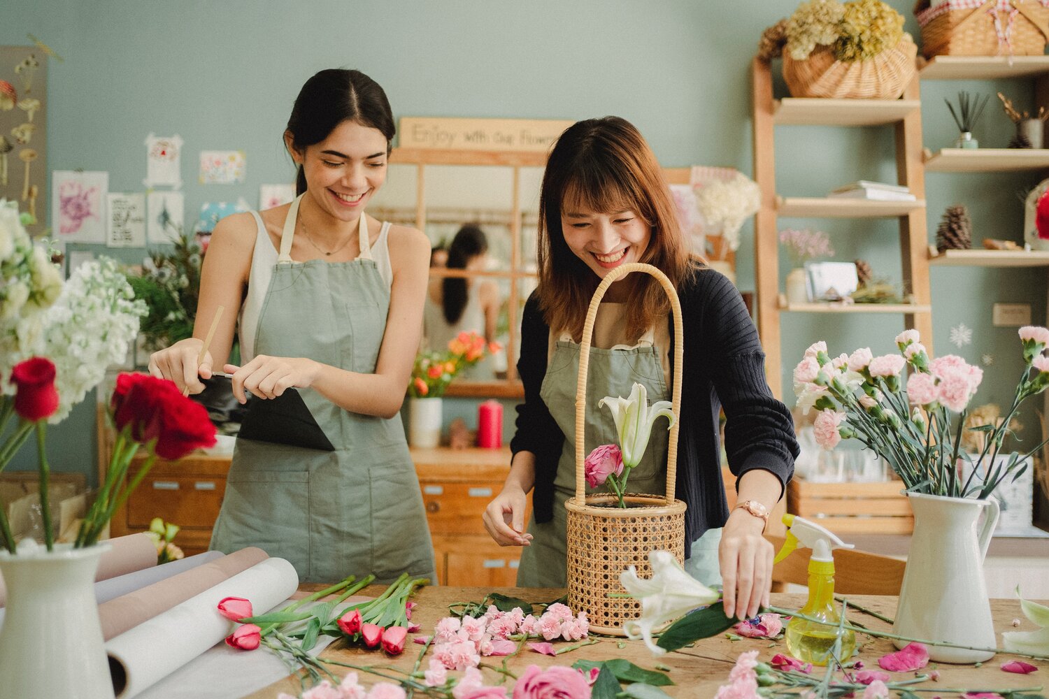 two friends arranging flowers