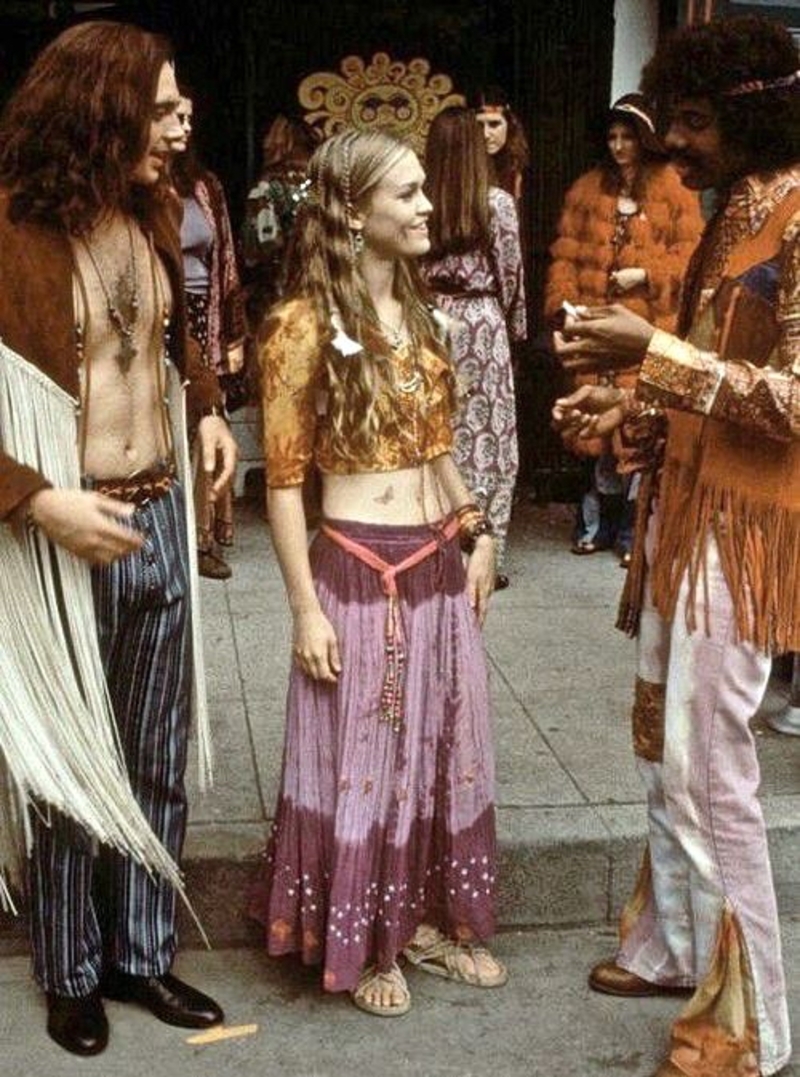 3 people in hippie style in a concert 1960s