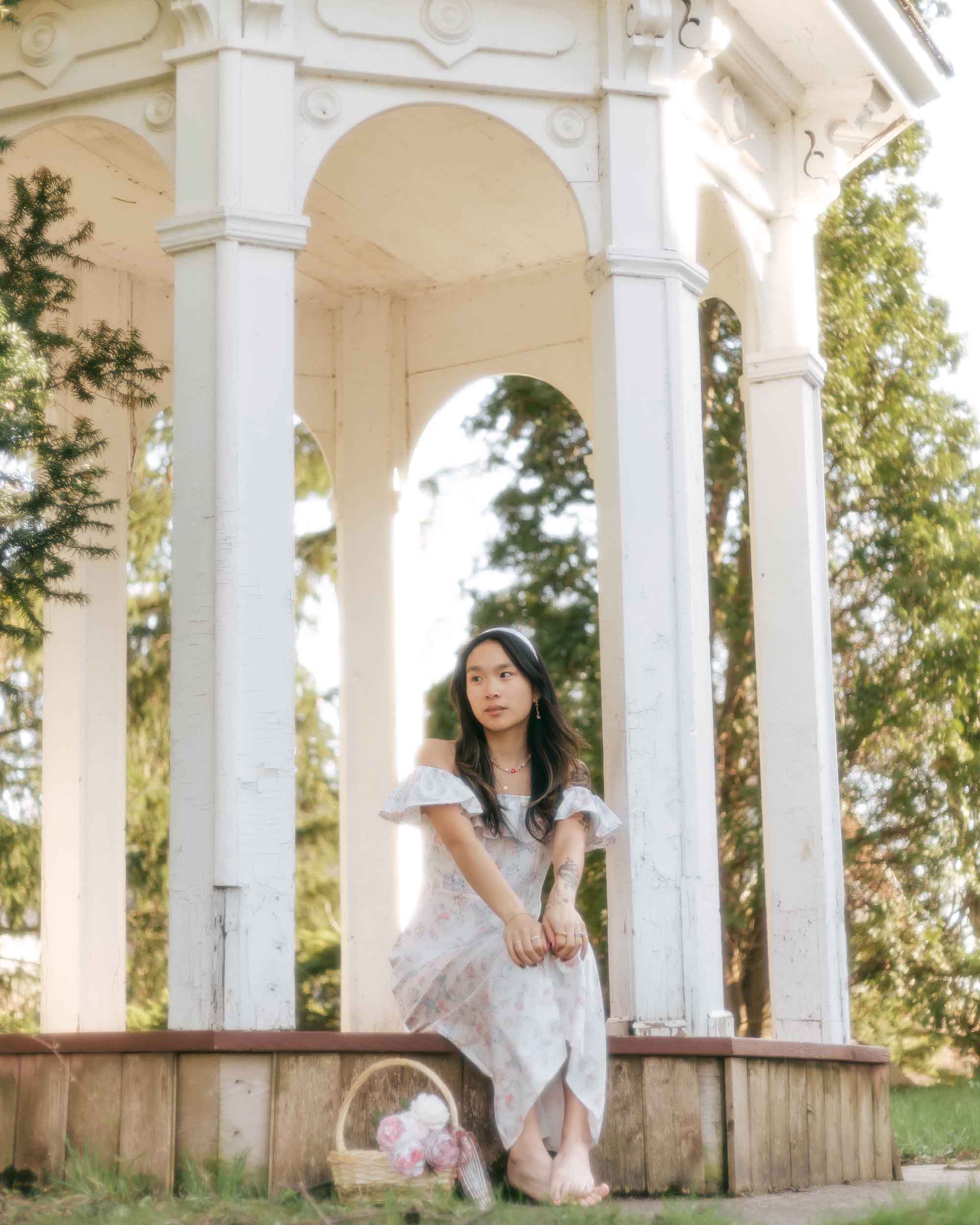 Introverted girl under gazebo