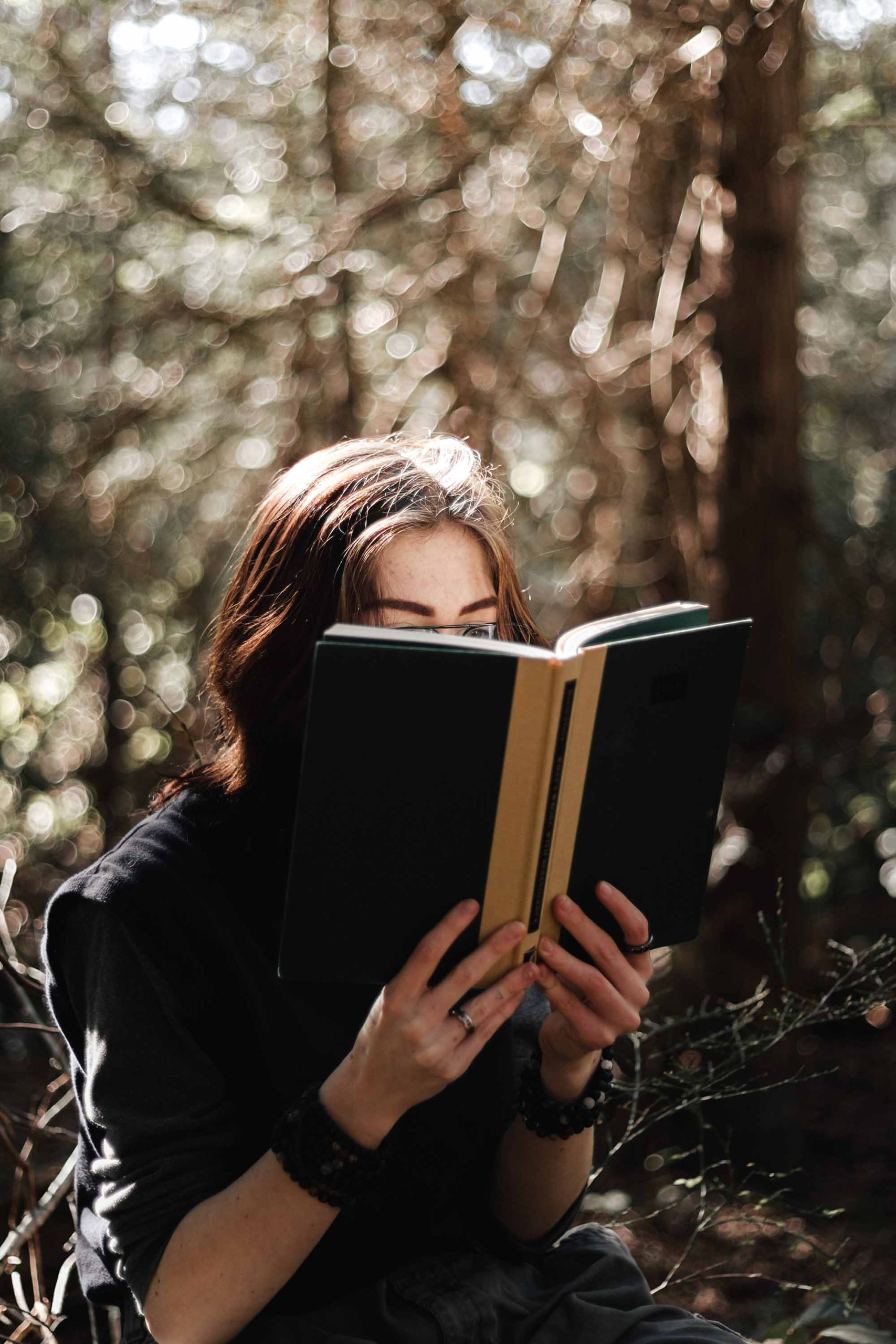 Introverted girl reading a book